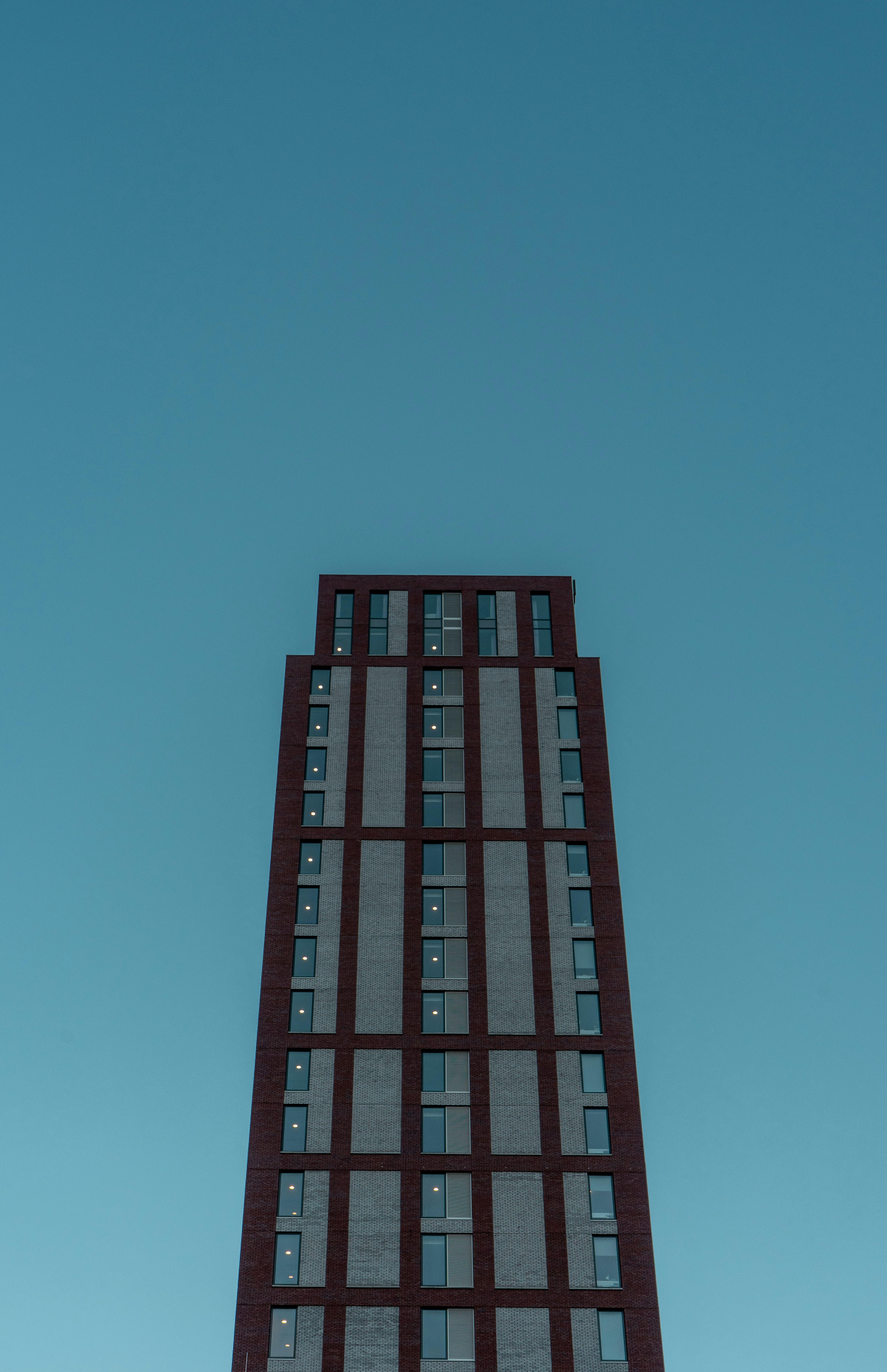 red and black building under blue sky